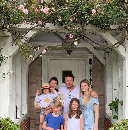 Jamie Oliver with his wife Jools and their children: Poppy Honey Rosie, Daisy Boo Pamela, Petal Blossom Rainbow Oliver, and Buddy Bear Maurice.